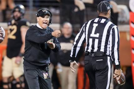 Nov 12, 2022; Winston-Salem, North Carolina, USA;  Wake Forest Demon Deacons head coach Dave Clawson calls out to an official during the second half against the North Carolina Tar Heels at Truist Field. Mandatory Credit: Jim Dedmon-USA TODAY Sports