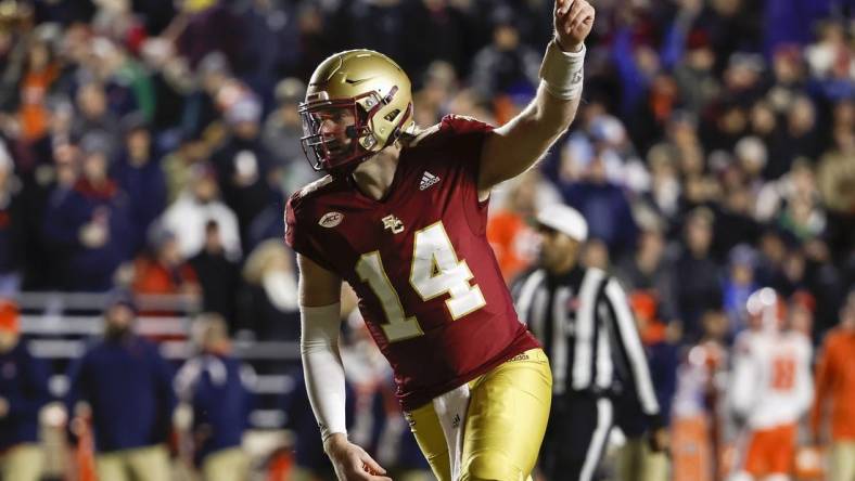 Nov 26, 2022; Chestnut Hill, Massachusetts, USA; Boston College Eagles quarterback Emmett Morehead (14) celebrates a touchdown against the Syracuse Orange during the first quarter at Alumni Stadium. Mandatory Credit: Winslow Townson-USA TODAY Sports