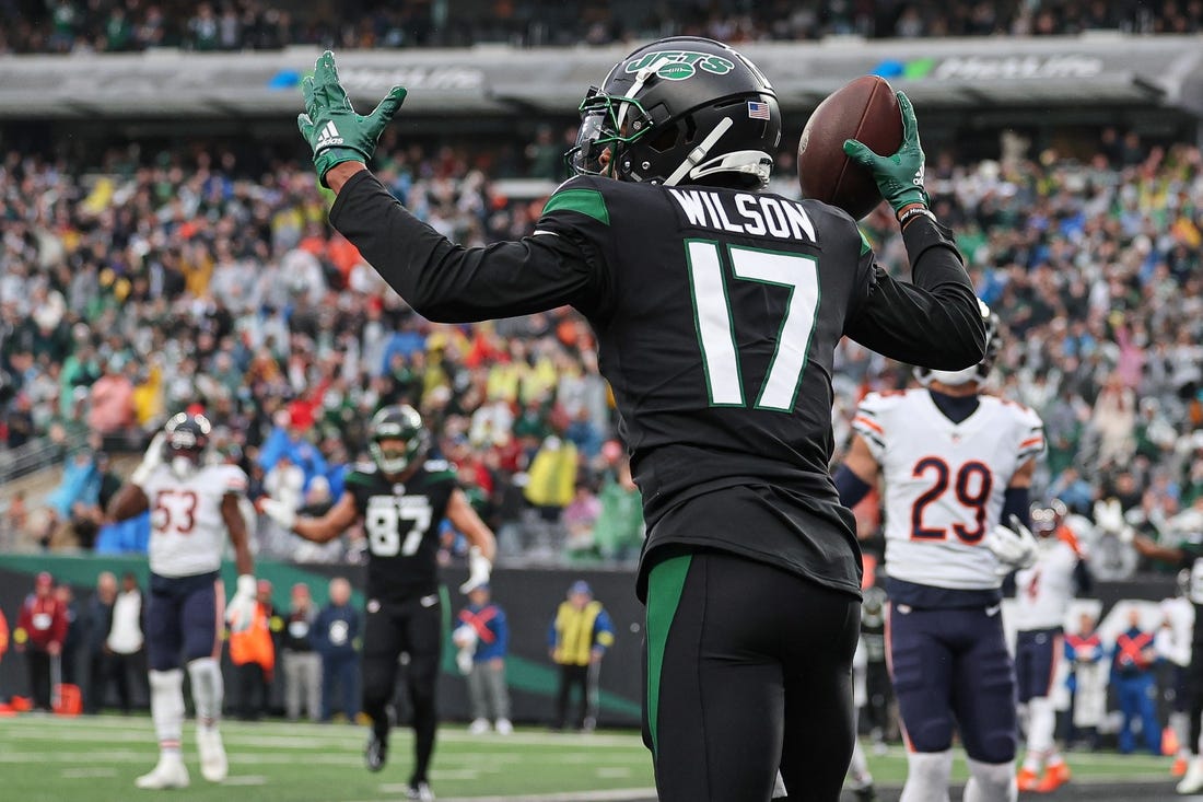 Nov 27, 2022; East Rutherford, New Jersey, USA; New York Jets wide receiver Garrett Wilson (17) celebrates his touchdown reception during the first quarter against the Chicago Bears at MetLife Stadium. Mandatory Credit: Vincent Carchietta-USA TODAY Sports