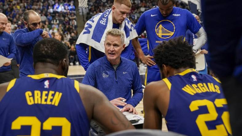 Nov 27, 2022; Minneapolis, Minnesota, USA; Golden State Warriors head coach Steve Kerr talks to his players during a timeout against the Minnesota Timberwolves in the second quarter at Target Center. Mandatory Credit: Nick Wosika-USA TODAY Sports