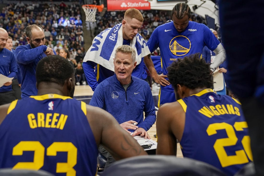 Nov 27, 2022; Minneapolis, Minnesota, USA; Golden State Warriors head coach Steve Kerr talks to his players during a timeout against the Minnesota Timberwolves in the second quarter at Target Center. Mandatory Credit: Nick Wosika-USA TODAY Sports