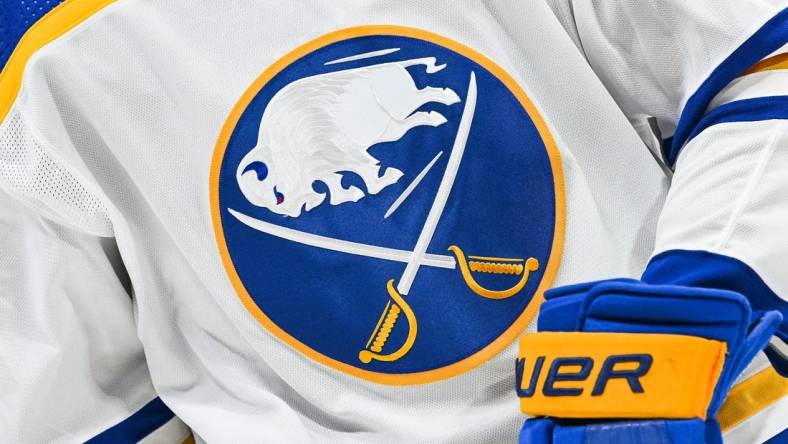 Nov 22, 2022; Montreal, Quebec, CAN; View of a Buffalo Sabres logo on a jersey worn by a member of the team during warm-up before the game against the Montreal Canadiens at Bell Centre. Mandatory Credit: David Kirouac-USA TODAY Sports