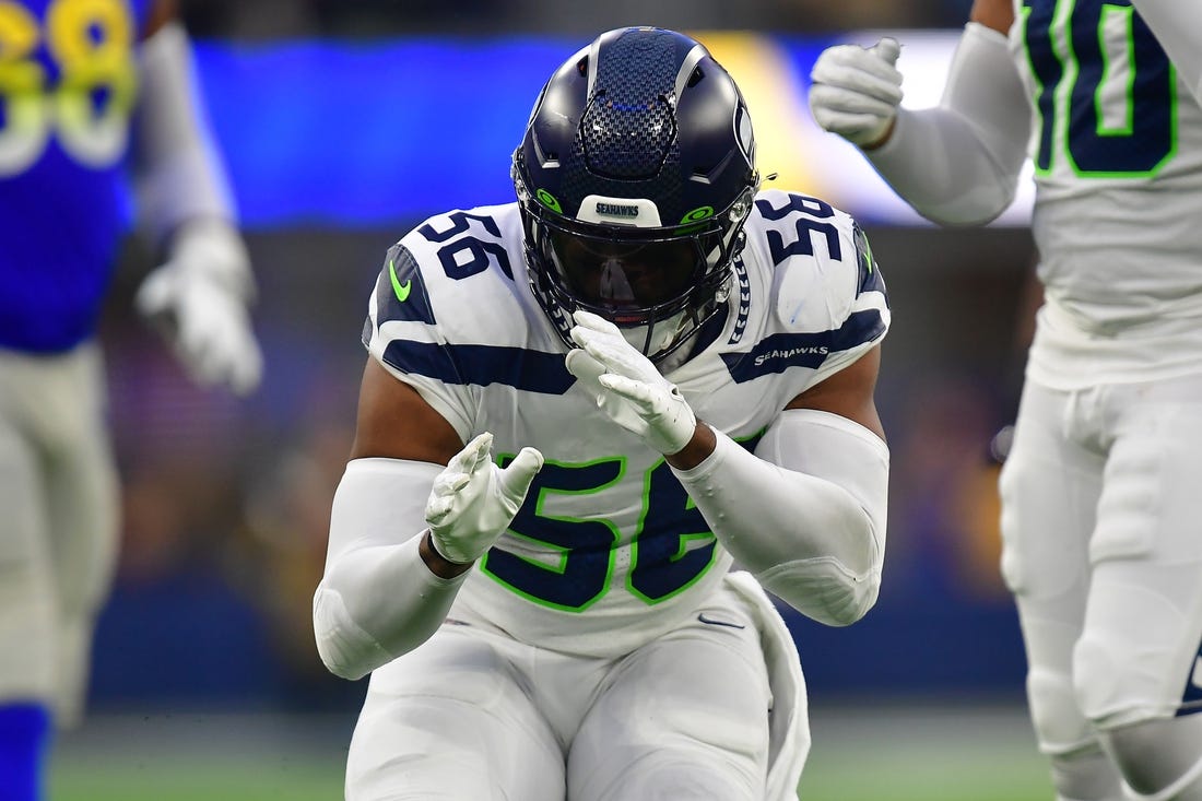 Dec 4, 2022; Inglewood, California, USA; Seattle Seahawks linebacker Jordyn Brooks (56) reacts after sacking Los Angeles Rams quarterback John Wolford (13) during the second half at SoFi Stadium. Mandatory Credit: Gary A. Vasquez-USA TODAY Sports