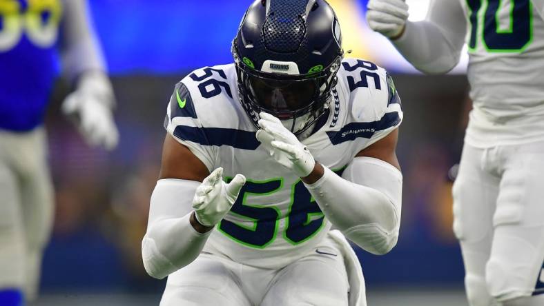 Dec 4, 2022; Inglewood, California, USA; Seattle Seahawks linebacker Jordyn Brooks (56) reacts after sacking Los Angeles Rams quarterback John Wolford (13) during the second half at SoFi Stadium. Mandatory Credit: Gary A. Vasquez-USA TODAY Sports