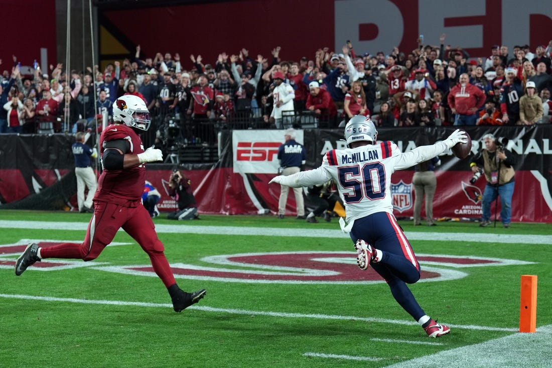 Dec 12, 2022; Glendale, Arizona, USA; New England Patriots linebacker Raekwon McMillan (50) returns a fumble for a touchdown against the Arizona Cardinals during the second half at State Farm Stadium. Mandatory Credit: Joe Camporeale-USA TODAY Sports