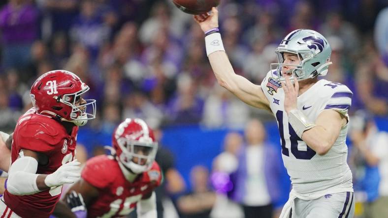 Dec 31, 2022; New Orleans, LA, USA; Kansas State Wildcats quarterback Will Howard (18) throws against the Alabama Crimson Tide during the second half in the 2022 Sugar Bowl at Caesars Superdome. Mandatory Credit: Andrew Wevers-USA TODAY Sports