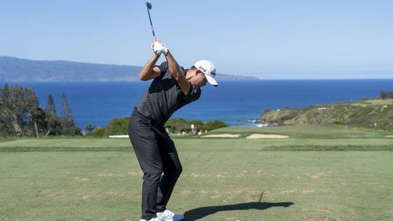 January 8, 2023; Maui, Hawaii, USA; Collin Morikawa hits his tee shot on the 11th hole during the final round of the Sentry Tournament of Champions golf tournament at Kapalua Resort - The Plantation Course. Mandatory Credit: Kyle Terada-USA TODAY Sports