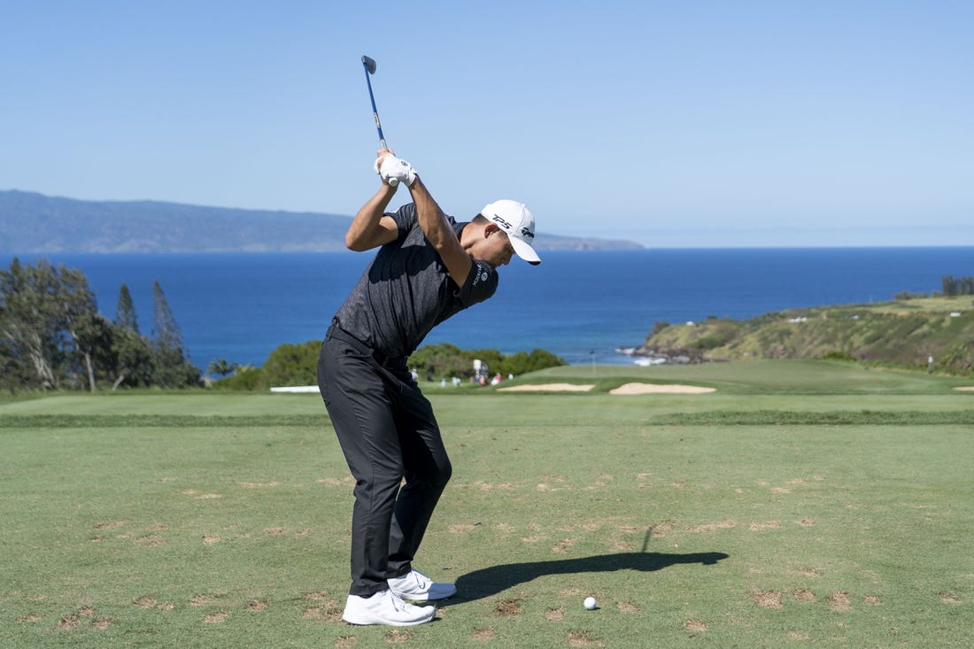 January 8, 2023; Maui, Hawaii, USA; Collin Morikawa hits his tee shot on the 11th hole during the final round of the Sentry Tournament of Champions golf tournament at Kapalua Resort - The Plantation Course. Mandatory Credit: Kyle Terada-USA TODAY Sports