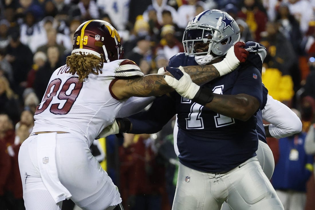 Jan 8, 2023; Landover, Maryland, USA; Dallas Cowboys offensive tackle Jason Peters (71) blocks Washington Commanders defensive end Chase Young (99) at FedExField. Mandatory Credit: Geoff Burke-USA TODAY Sports