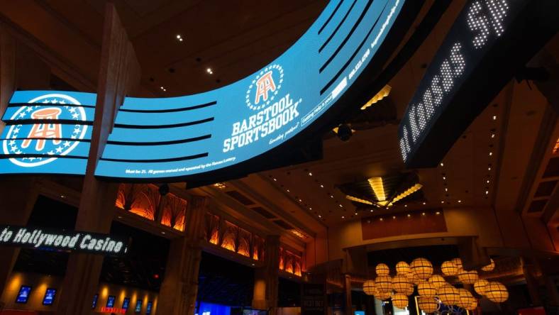 Digital banners advertise Barstool Sportsbook within Hollywood Casino where people can how legally place sports bets in the state.