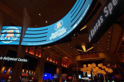 Digital banners advertise Barstool Sportsbook within Hollywood Casino where people can how legally place sports bets in the state.