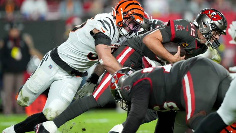 Cincinnati Bengals linebacker Logan Wilson (55) sacks Tampa Bay Buccaneers quarterback Tom Brady (12) in the third quarter during a Week 15 NFL game, Sunday, Dec. 18, 2022, at Raymond James Stadium in Tampa, Fla. The Cincinnati Bengals won, 34-23. The Cincinnati Bengals improved to 10-4 on the season.

Nfl Cincinnati Bengals At Tampa Bay Buccaneers Dec 18 0098