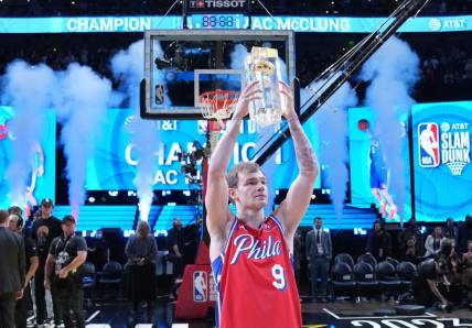 Feb 18, 2023; Salt Lake City, UT, USA; Philadelphia 76ers guard Mac McClung (9) celebrates with the trophy after winning the Dunk Contest during the 2023 All Star Saturday Night at Vivint Arena. Mandatory Credit: Kyle Terada-USA TODAY Sports