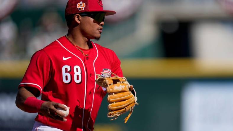 Cincinnati Reds shortstop Noelvi Marte (68) plays a ground ball off the bat of Cleveland Guardians Jhonkensy Noel in the sixth inning of the MLB Cactus League spring training game between the Cincinnati Reds and the Cleveland Guardians at Goodyear Ballpark in Goodyear, Ariz., on Saturday, Feb. 25, 2023.

Cleveland Guardians At Cincinnati Reds Spring Training