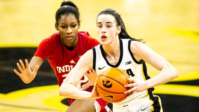Iowa guard Caitlin Clark, right, passes the ball as Indiana guard Chloe Moore-McNeil defends during a NCAA Big Ten Conference women's basketball game, Sunday, Feb. 26, 2023, at Carver-Hawkeye Arena in Iowa City, Iowa.

230226 Indiana Iowa Wbb 036 Jpg