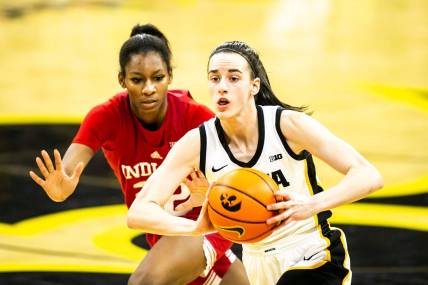 Iowa guard Caitlin Clark, right, passes the ball as Indiana guard Chloe Moore-McNeil defends during a NCAA Big Ten Conference women's basketball game, Sunday, Feb. 26, 2023, at Carver-Hawkeye Arena in Iowa City, Iowa.

230226 Indiana Iowa Wbb 036 Jpg