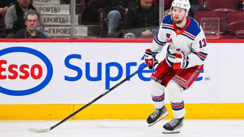 Mar 9, 2023; Montreal, Quebec, CAN; New York Rangers left wing Alexis Lafreniere (13) against the Montreal Canadiens during the third period at Bell Centre. Mandatory Credit: David Kirouac-USA TODAY Sports