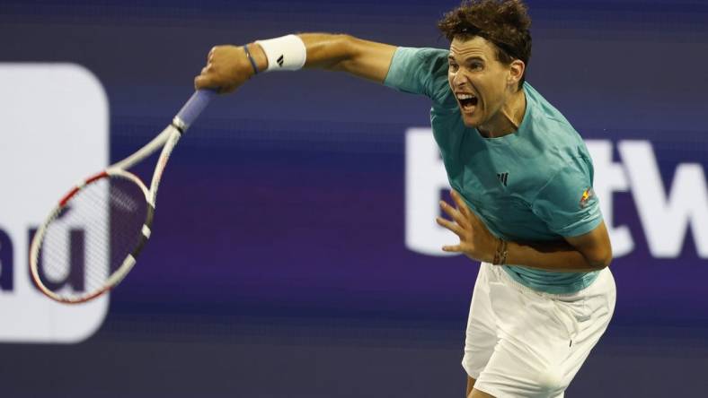 Mar 23, 2023; Miami, Florida, US; Dominic Thiem (AUT) serves against Lorenzo Sonego (ITA) (not pictured) on day four of the Miami Open at Hard Rock Stadium. Mandatory Credit: Geoff Burke-USA TODAY Sports