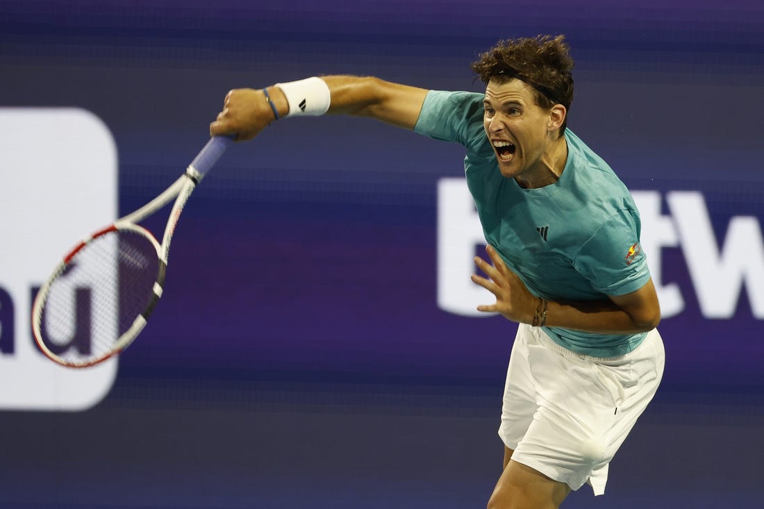 Mar 23, 2023; Miami, Florida, US; Dominic Thiem (AUT) serves against Lorenzo Sonego (ITA) (not pictured) on day four of the Miami Open at Hard Rock Stadium. Mandatory Credit: Geoff Burke-USA TODAY Sports