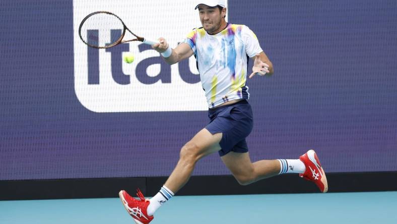 Mar 26, 2023; Miami, Florida, US; Dusan Lajovic (SRB) hits a forehand against Carlos Alcaraz (ESP) (not pictured) on day seven of the Miami Open at Hard Rock Stadium. Mandatory Credit: Geoff Burke-USA TODAY Sports