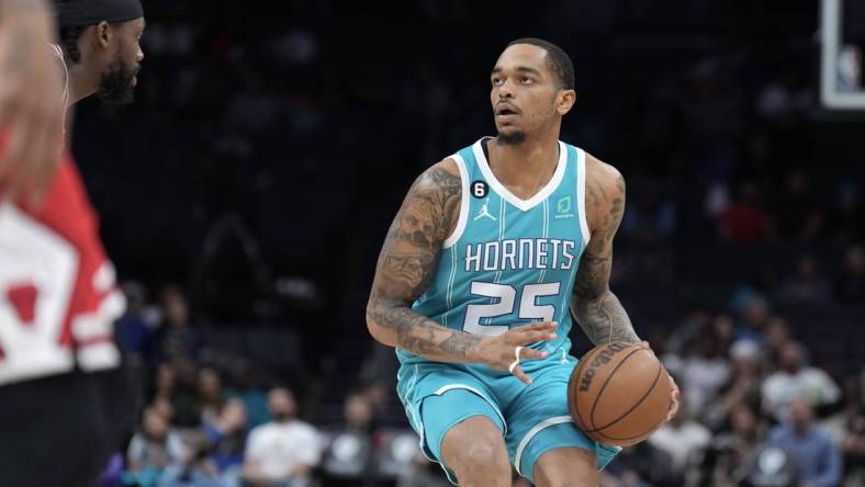 Mar 31, 2023; Charlotte, North Carolina, USA;  Charlotte Hornets forward P.J. Washington (25) looks for the basket in the first quarter against the Chicago Bulls at Spectrum Center. Mandatory Credit: David Yeazell-USA TODAY Sports