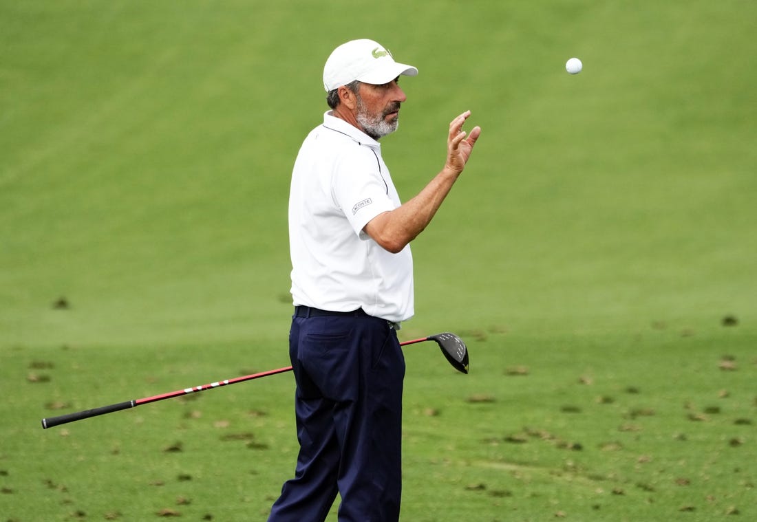 Apr 3, 2023; Augusta, Georgia, USA; Jose Maria Olazabal catches a ball tossed by his caddie on the practice range during a practice round for The Masters golf tournament at Augusta National Golf Club. Mandatory Credit: Rob Schumacher-USA TODAY Network