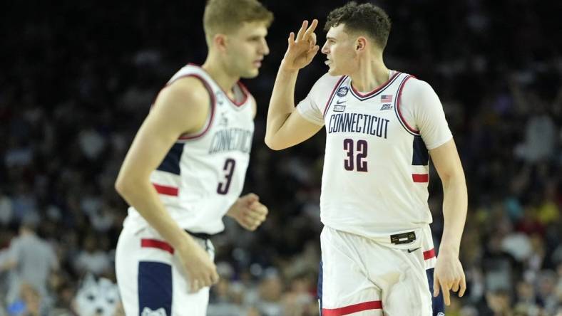 Apr 3, 2023; Houston, TX, USA; Connecticut Huskies center Donovan Clingan (32) reacts after a play against the San Diego State Aztecs during the first half in the national championship game of the 2023 NCAA Tournament at NRG Stadium. Mandatory Credit: Bob Donnan-USA TODAY Sports