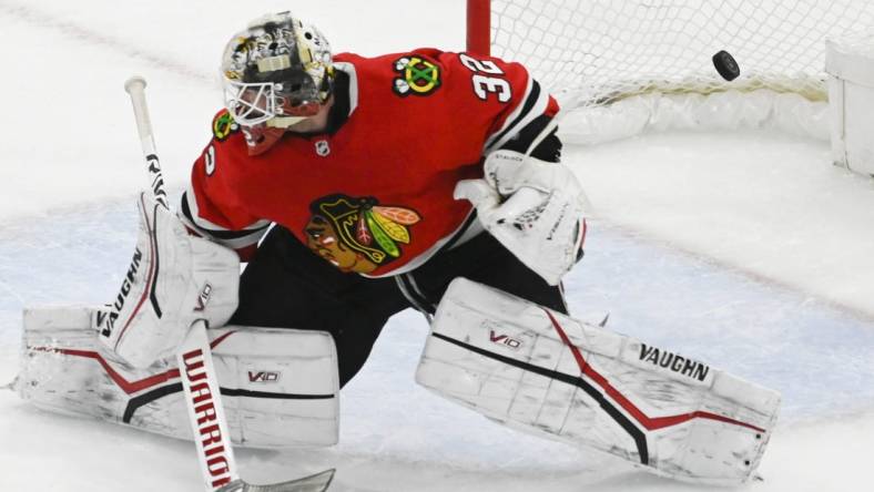 Apr 10, 2023; Chicago, Illinois, USA;  Chicago Blackhawks goaltender Alex Stalock (32) cannot stop a goal by Minnesota Wild left wing Marcus Johansson (90) during the third period at the United Center. Mandatory Credit: Matt Marton-USA TODAY Sports