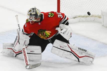 Apr 10, 2023; Chicago, Illinois, USA;  Chicago Blackhawks goaltender Alex Stalock (32) cannot stop a goal by Minnesota Wild left wing Marcus Johansson (90) during the third period at the United Center. Mandatory Credit: Matt Marton-USA TODAY Sports