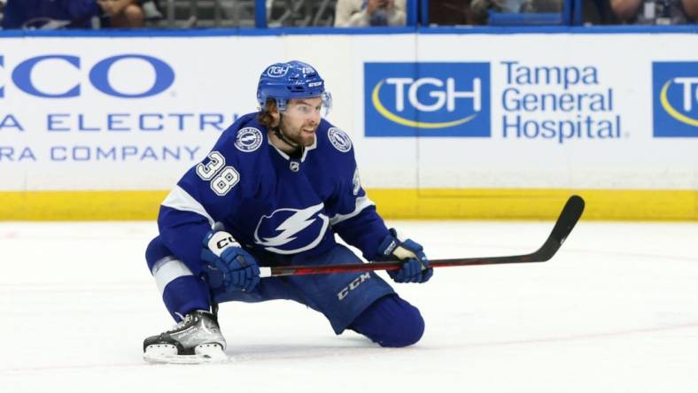 Apr 13, 2023; Tampa, Florida, USA; Tampa Bay Lightning left wing Brandon Hagel (38) scores a goal against the Detroit Red Wings during the third period at Amalie Arena. Mandatory Credit: Kim Klement-USA TODAY Sports