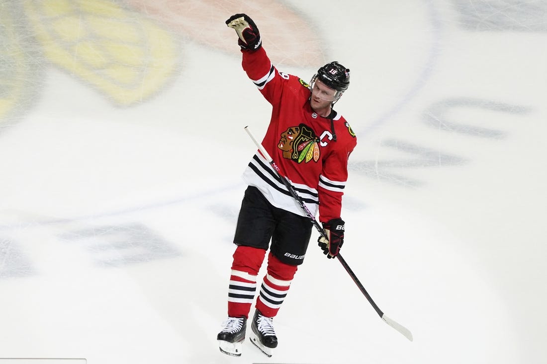 Apr 13, 2023; Chicago, Illinois, USA; Chicago Blackhawks center Jonathan Toews (19) is honored after the game against the Philadelphia Flyers. He played his last game as a Blackhawk, at United Center. Mandatory Credit: David Banks-USA TODAY Sports