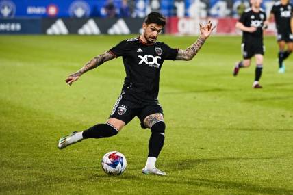 Apr 15, 2023; Montreal, Quebec, CAN;DC United forward Taxi Fountas (11) kicks the ball during the first half against D.C. United at Stade Saputo. Mandatory Credit: David Kirouac-USA TODAY Sports