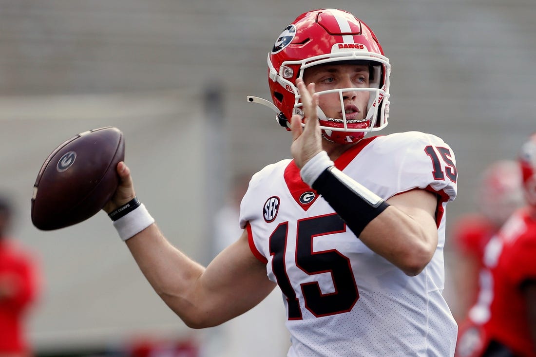 Georgia quarterback Carson Beck (15) throws the ball during the UGA G-Day spring football game at Sanford Stadium in Athens on Saturday.

News Joshua L Jones