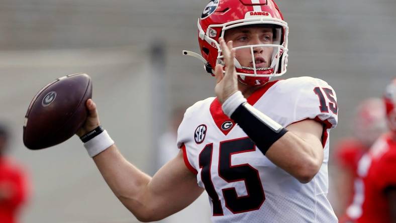 Georgia quarterback Carson Beck (15) throws the ball during the UGA G-Day spring football game at Sanford Stadium in Athens on Saturday.

News Joshua L Jones