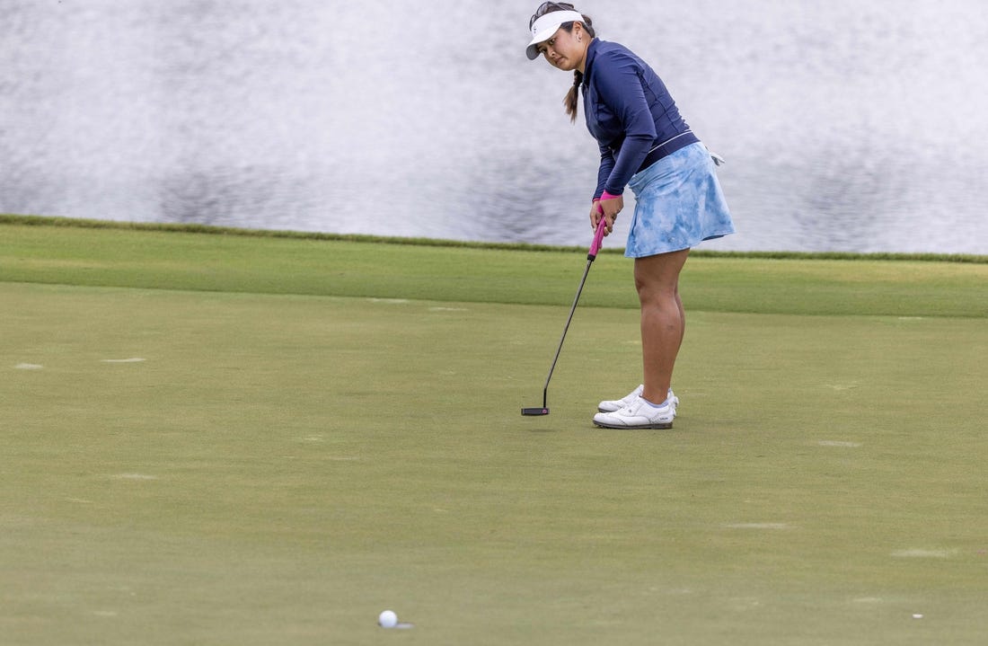 Apr 21, 2023; The Woodlands, Texas, USA;  Lilia Vu (USA) sinks a putt on the ninth green during the second round of The Chevron Championship golf tournament. Mandatory Credit: Thomas Shea-USA TODAY Sports