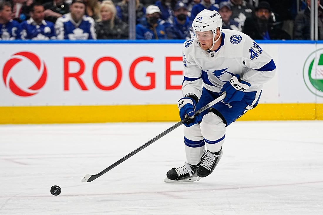 Apr 18, 2023; Toronto, Ontario, CAN; Tampa Bay Lightning defenseman Darren Raddysh (43) tries to control a puck during game one of the first round of the 2023 Stanley Cup Playoffs at Scotiabank Arena. Mandatory Credit: John E. Sokolowski-USA TODAY Sports