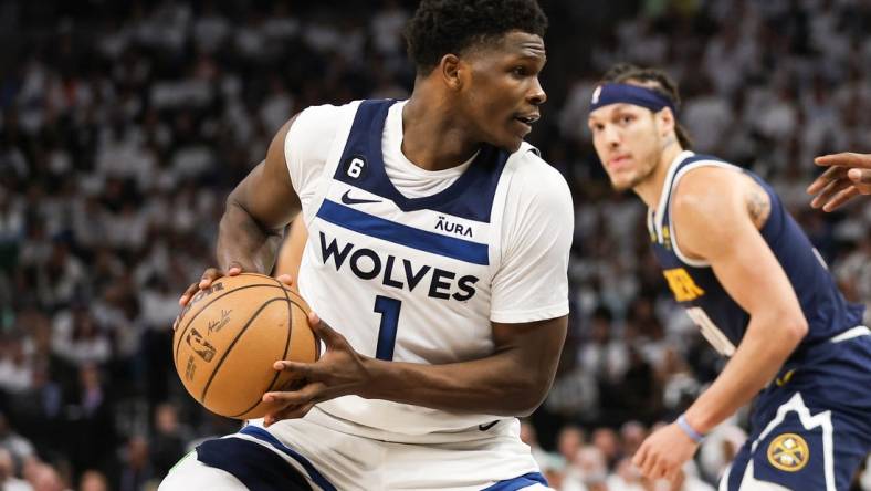 Apr 23, 2023; Minneapolis, Minnesota, USA; Minnesota Timberwolves guard Anthony Edwards (1) controls the ball against the Denver Nuggets during the fourth quarter of game four of the 2023 NBA Playoffs at Target Center. Mandatory Credit: Matt Krohn-USA TODAY Sports