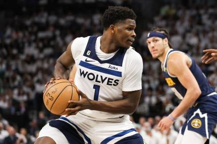 Apr 23, 2023; Minneapolis, Minnesota, USA; Minnesota Timberwolves guard Anthony Edwards (1) controls the ball against the Denver Nuggets during the fourth quarter of game four of the 2023 NBA Playoffs at Target Center. Mandatory Credit: Matt Krohn-USA TODAY Sports