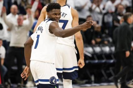 Apr 23, 2023; Minneapolis, Minnesota, USA; Minnesota Timberwolves guard Anthony Edwards (1) reacts to his shot against the Denver Nuggets during overtime of game four of the 2023 NBA Playoffs at Target Center. Mandatory Credit: Matt Krohn-USA TODAY Sports