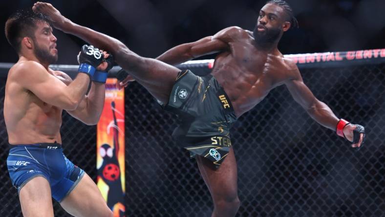 May 6, 2023; Newark, New Jersey, USA; Aljamain Sterling (red gloves) fights Henry Cejudo (blue gloves) during UFC 288 at Prudential Center. Mandatory Credit: Ed Mulholland-USA TODAY Sports