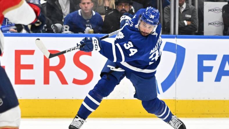 May 12, 2023; Toronto, Ontario, CAN;  Toronto Maple Leafs forward Auston Matthews (34) shoots the puck against the Florida Panthers in the first period in game five of the second round of the 2023 Stanley Cup Playoffs at Scotiabank Arena. Mandatory Credit: Dan Hamilton-USA TODAY Sports