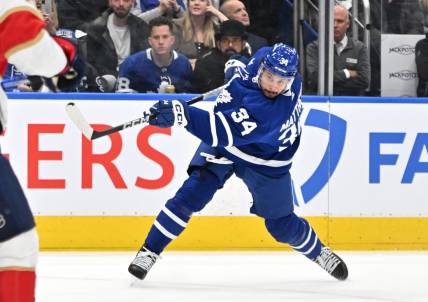 May 12, 2023; Toronto, Ontario, CAN;  Toronto Maple Leafs forward Auston Matthews (34) shoots the puck against the Florida Panthers in the first period in game five of the second round of the 2023 Stanley Cup Playoffs at Scotiabank Arena. Mandatory Credit: Dan Hamilton-USA TODAY Sports