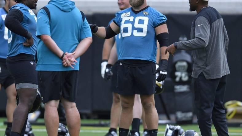 Jacksonville Jaguars center Tyler Shatley (69) talks with players and coaches during Monday morning's offseason camp session. Rookies and veterans gathered at TIAA Bank Field Monday, May 22, 2023 for the start of the Jacksonville Jaguars offseason camp. [Bob Self/Florida Times-Union]