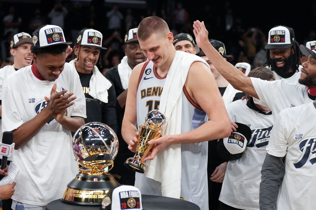 May 22, 2023; Los Angeles, California, USA; Denver Nuggets center Nikola Jokic (15) celebrates winning the Western Conference MVP Trophy and beating the Los Angeles Lakers in game four of the Western Conference Finals for the 2023 NBA playoffs at Crypto.com Arena. Mandatory Credit: Kirby Lee-USA TODAY Sports