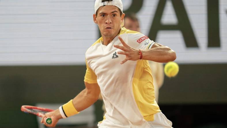 May 30, 2023; Paris,France; Sebastian Baez (ARG) returns a shot during his match against Gael Monfils (FRA) on day three at Stade Roland-Garros. Mandatory Credit: Susan Mullane-USA TODAY Sports