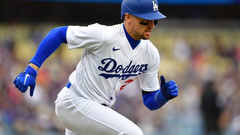 May 31, 2023; Los Angeles, California, USA; Los Angeles Dodgers center fielder Trayce Thompson (25) runs after hitting a single against the Washington Nationals during the fourth inning at Dodger Stadium. Mandatory Credit: Gary A. Vasquez-USA TODAY Sports