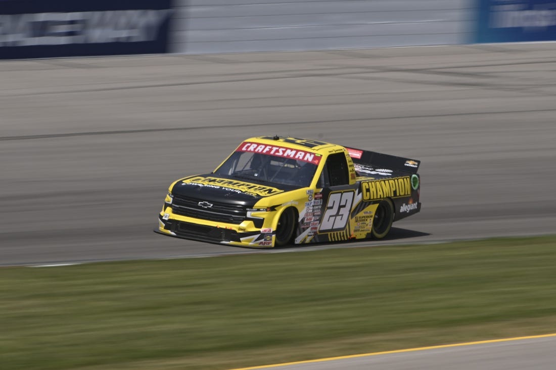 Jun 3, 2023; Madison, Illinois, USA; NASCAR Craftsman Truck Series Grant Enfinger (23) races during the Truck Series Toyota 200 at World Wide Technology Raceway. Mandatory Credit: Joe Puetz-USA TODAY Sports