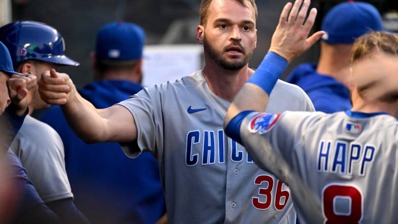 Jun 7, 2023; Anaheim, California, USA;  Chicago Cubs first baseman Trey Mancini (36) is greeted in the dugout after an RBI double and scoring a run in the fifth inning against the Los Angeles Angels at Angel Stadium. Mandatory Credit: Jayne Kamin-Oncea-USA TODAY Sports