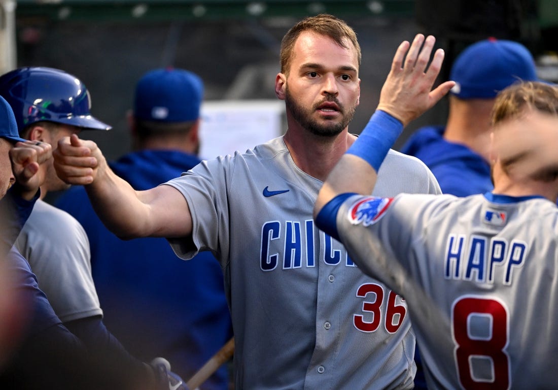 Jun 7, 2023; Anaheim, California, USA;  Chicago Cubs first baseman Trey Mancini (36) is greeted in the dugout after an RBI double and scoring a run in the fifth inning against the Los Angeles Angels at Angel Stadium. Mandatory Credit: Jayne Kamin-Oncea-USA TODAY Sports