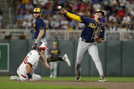Jun 13, 2023; Minneapolis, Minnesota, USA; Milwaukee Brewers second baseman Luis Urias (2) forces out Minnesota Twins pinch hitter Max Kepler (26) but cannot turn the double play in the eighth inning at Target Field. Mandatory Credit: Bruce Kluckhohn-USA TODAY Sports